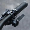 Velosipēdu zvans uz stūres riteņa kreiso pusi - melns